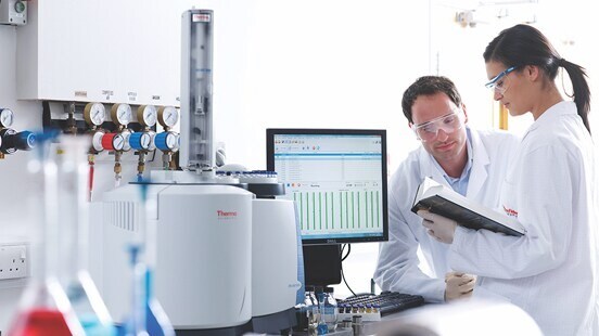 Technicians looking at tests results